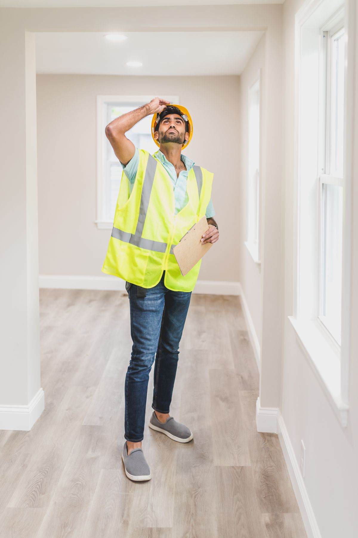 A professional carrying out a visual inspection inside a property